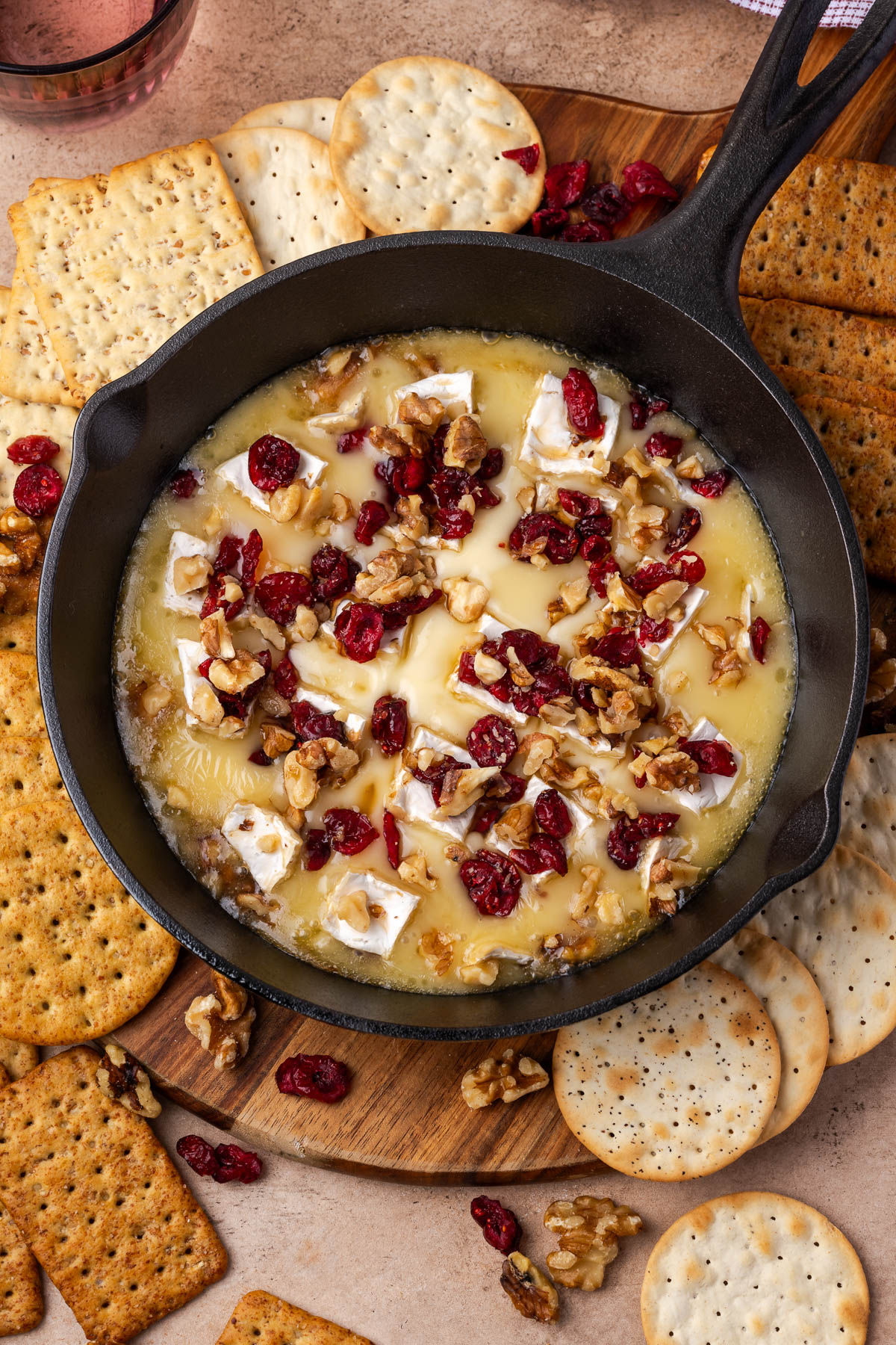 Baked brie with cranberries in a skillet
