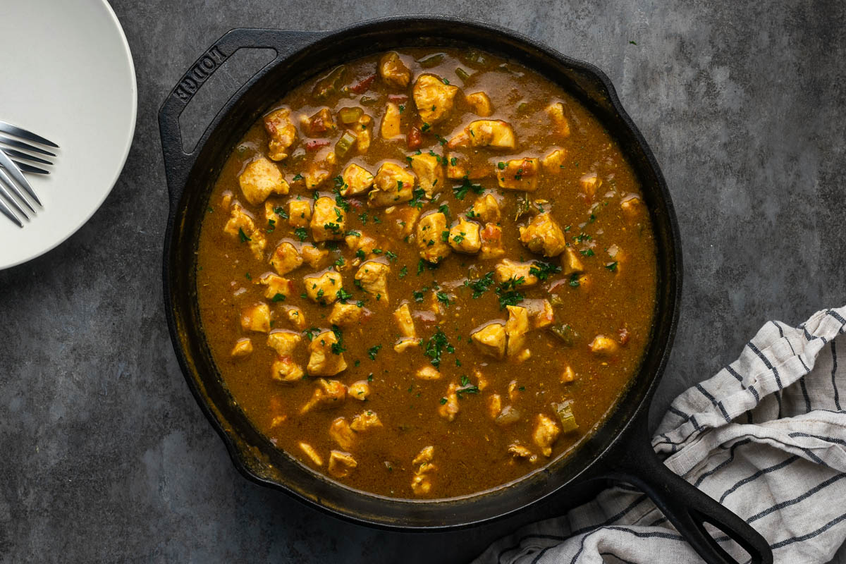Chicken curry after cooking in a skillet.
