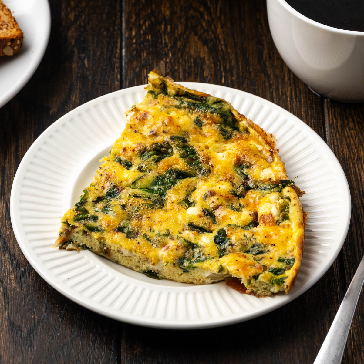 A serving of spinach frittata on a plate.