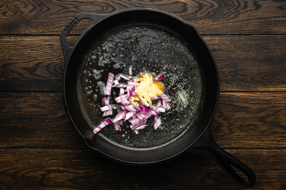 Cooking the onion and garlic in a skillet.