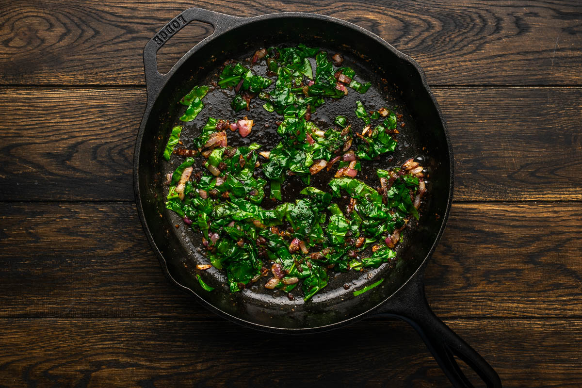 Spinach added to the skillet.