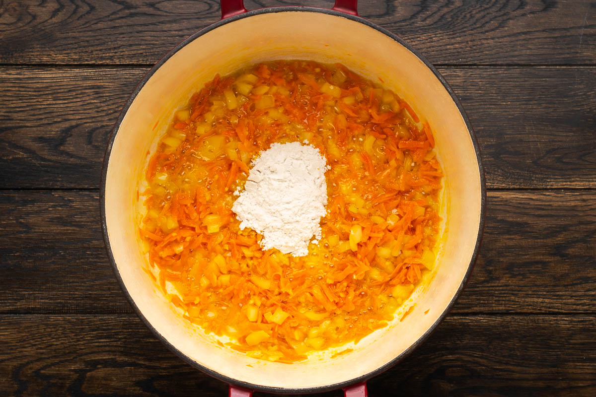 Flour added to the cooked vegetables.
