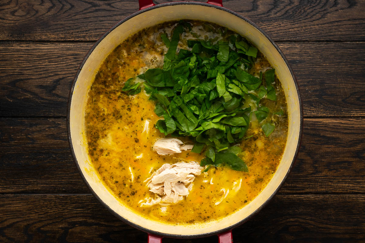 Chicken and spinach added to the pot.