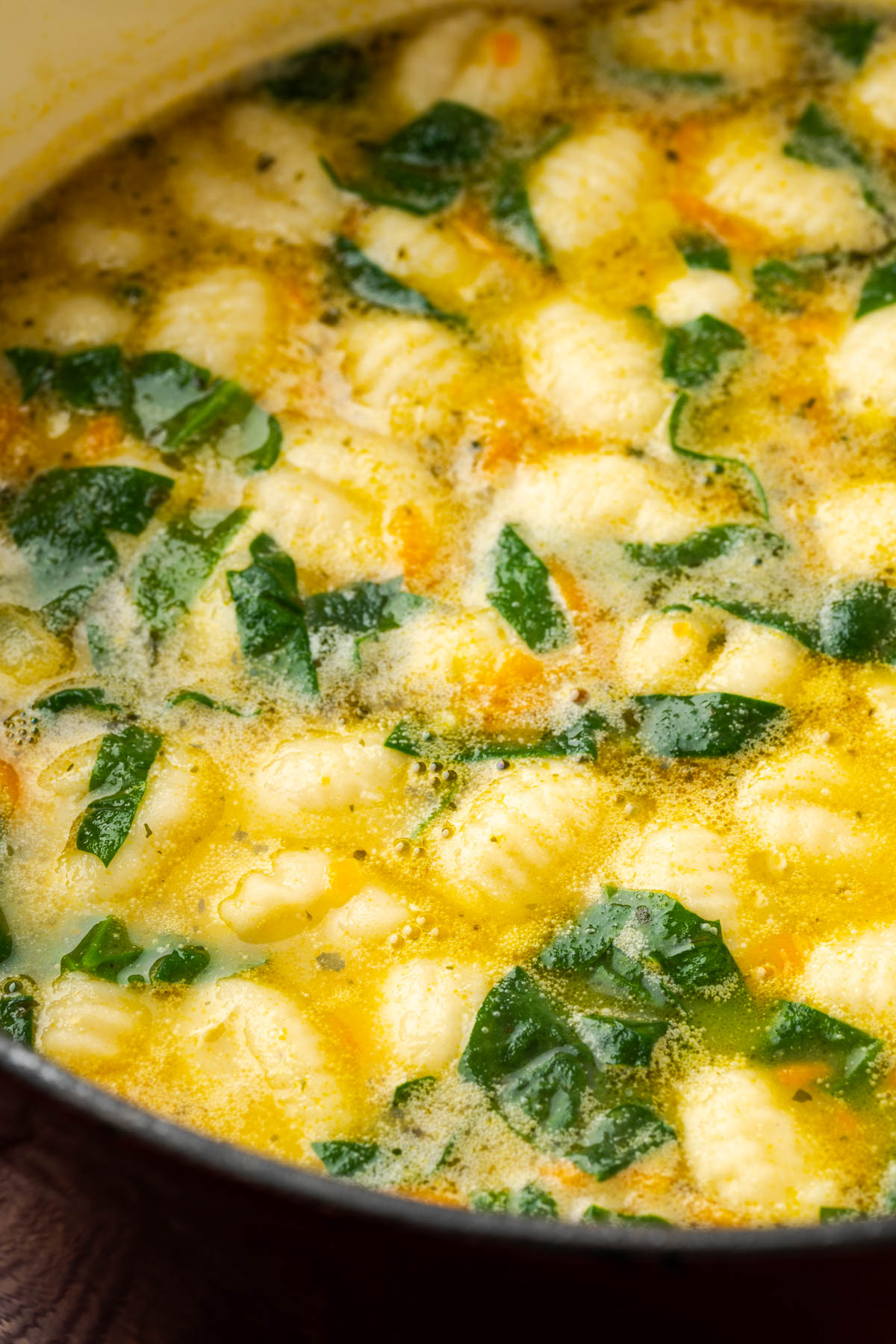Creamy chicken gnocchi soup in a large pot.