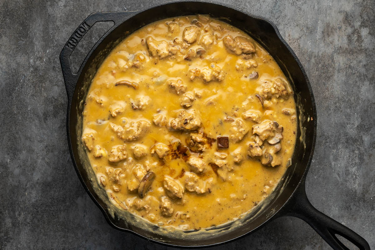 Sour cream added to the skillet of turkey strogaoff.