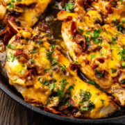 Cheesy bacon chicken cooked in a skilet.