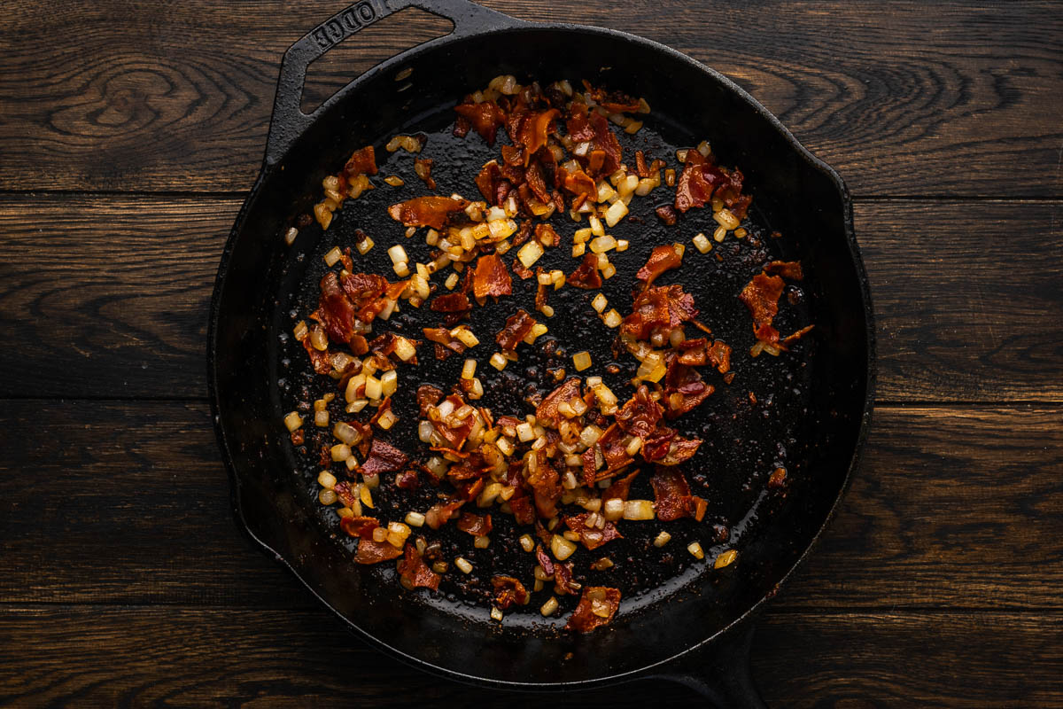 Bacon added to the cooked onions.