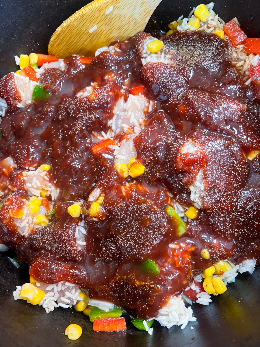 Worcestershire sauce, soy sauce, BBQ sauce, salt, pepper, granulated garlic, and chicken broth added to the dutch oven mixture.