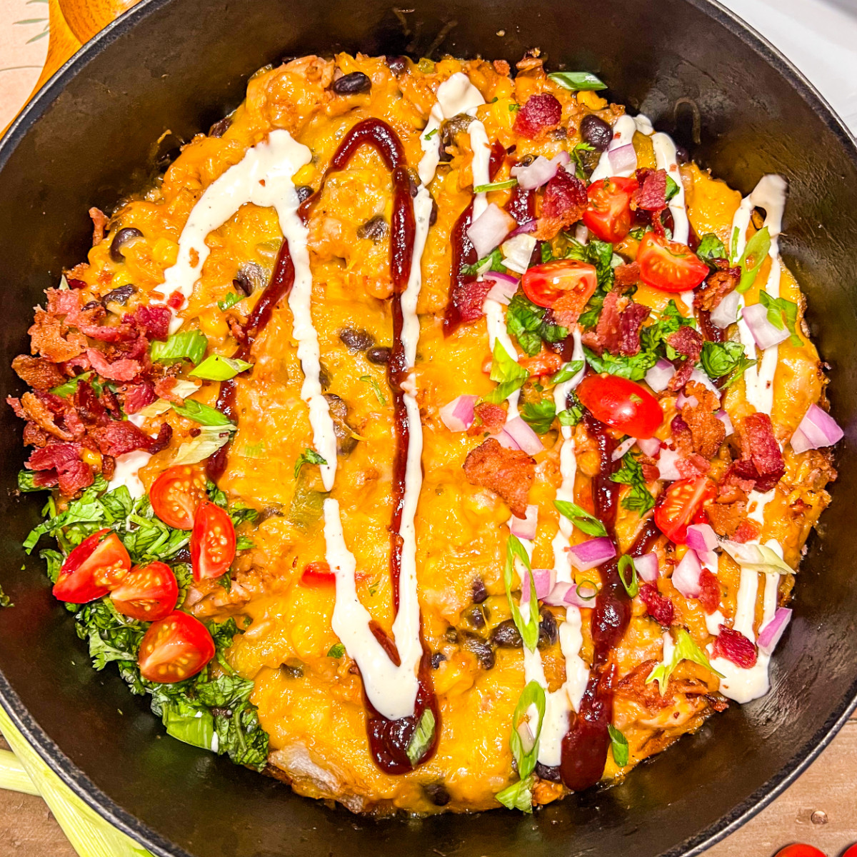 Image of barbecue chicken and rice garnished with lots of toppings.