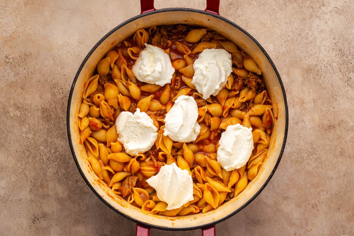 Ricotta cheese added on top of the pasta.