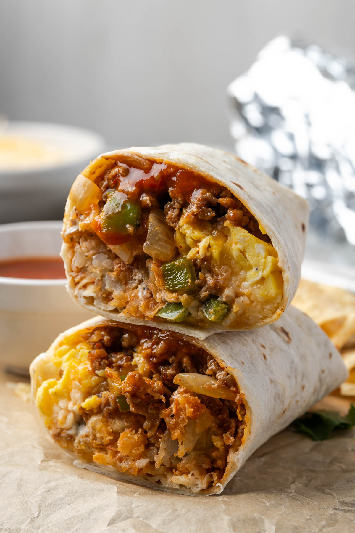 Breakfast burritos cut in half and stacked on top of each other. 