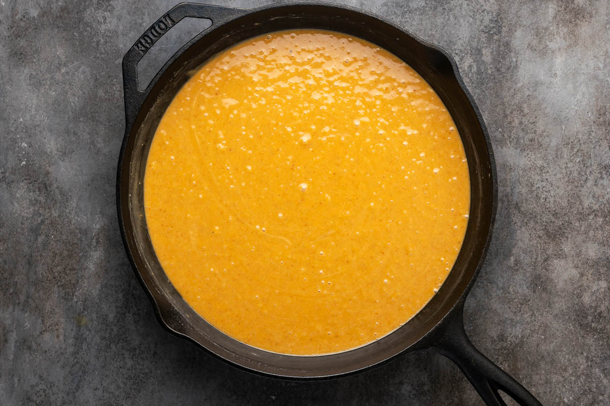 Peanut butter fudge mixture cooking in a skillet.