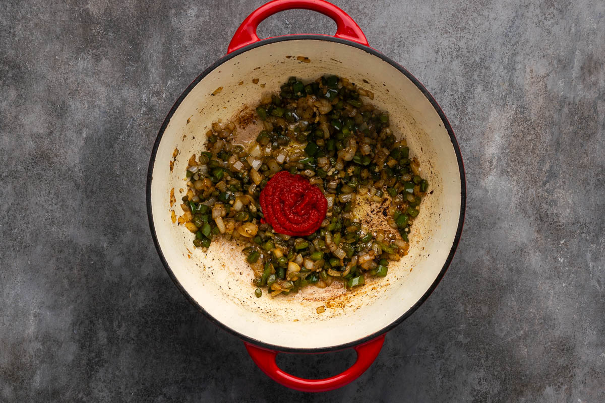 Tomato sauce and seasonings added to the pot.