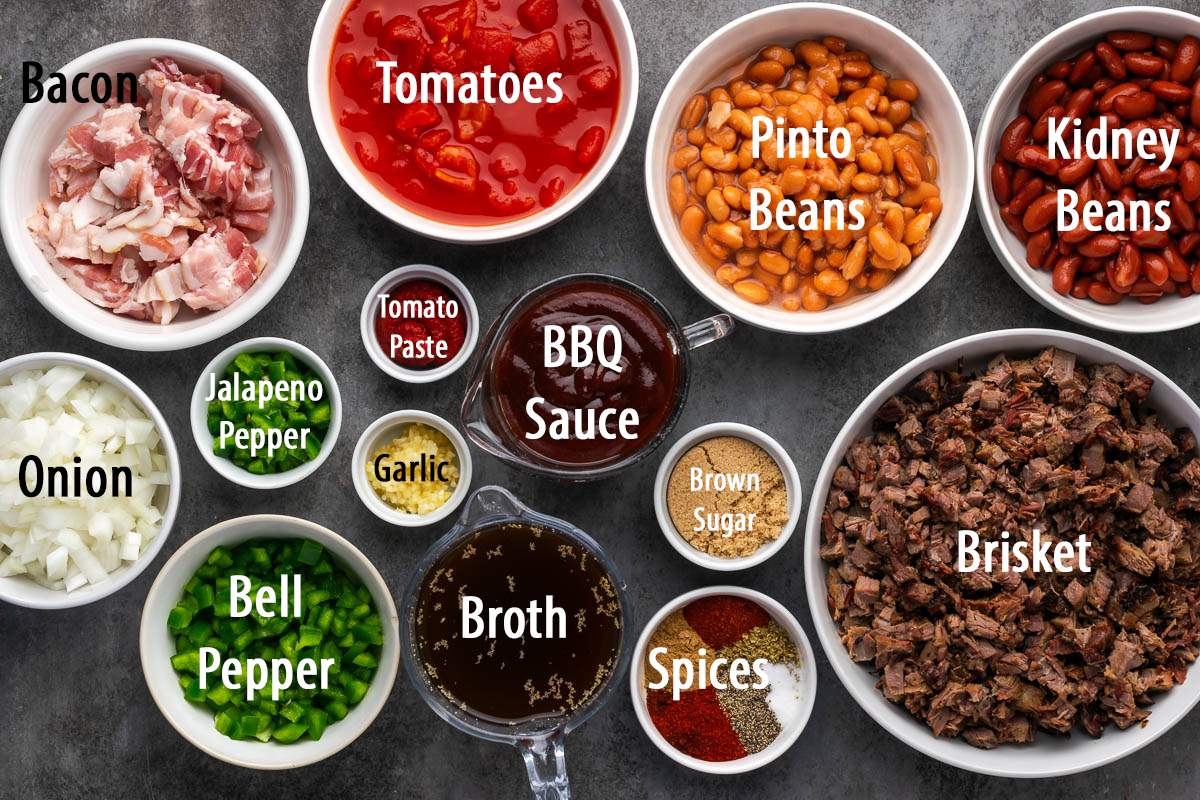 Ingredients to make brisket and beans in bowls on a table.