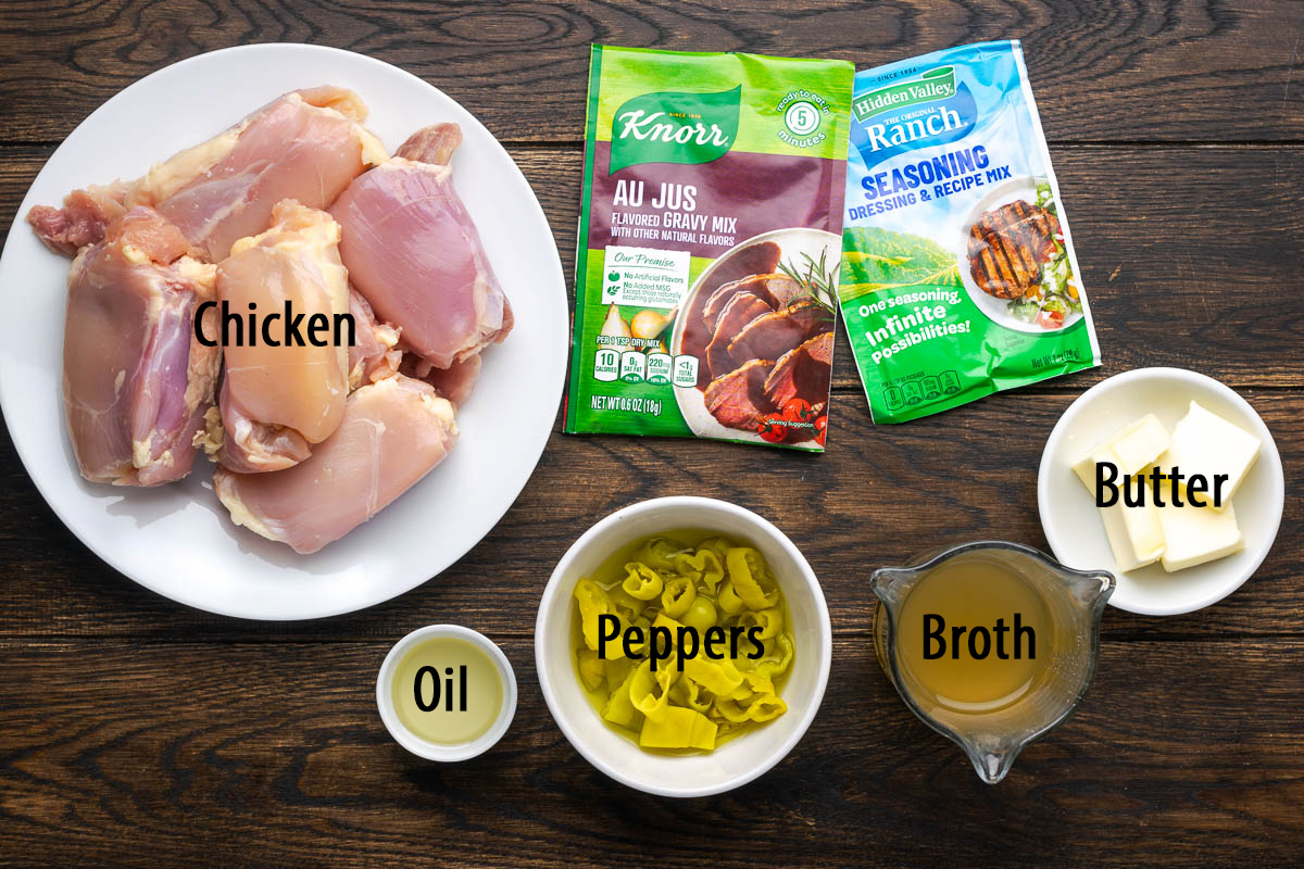 Ingredients to make Mississippi chicken in a Dutch oven on the table.