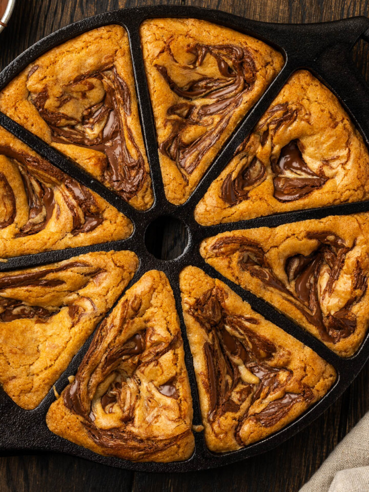 Nutella blondies with swirls still in a cast iron wedge pan.