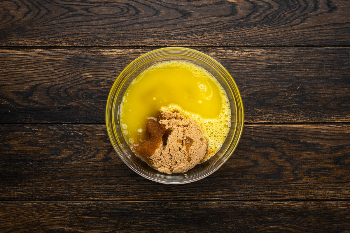Wet ingredients in a glass mixing bowl.