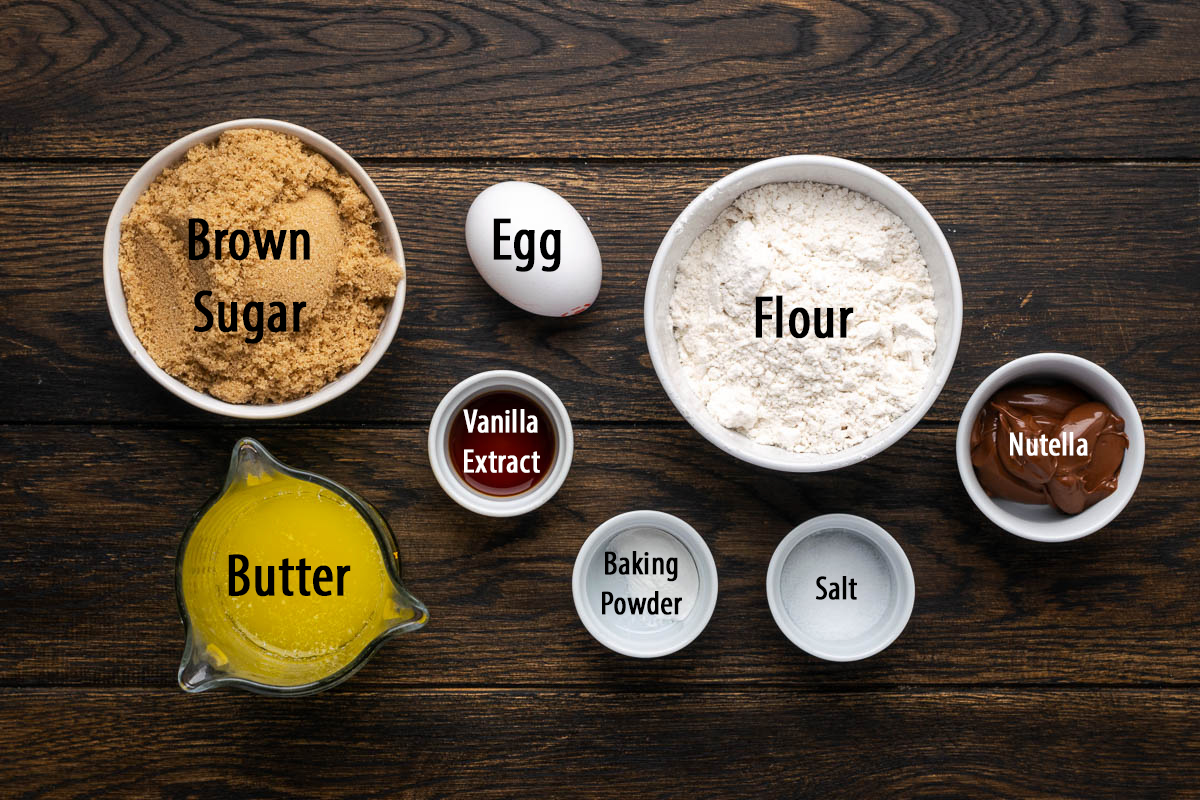 Ingredients to make nutella blondies on the table with labels.