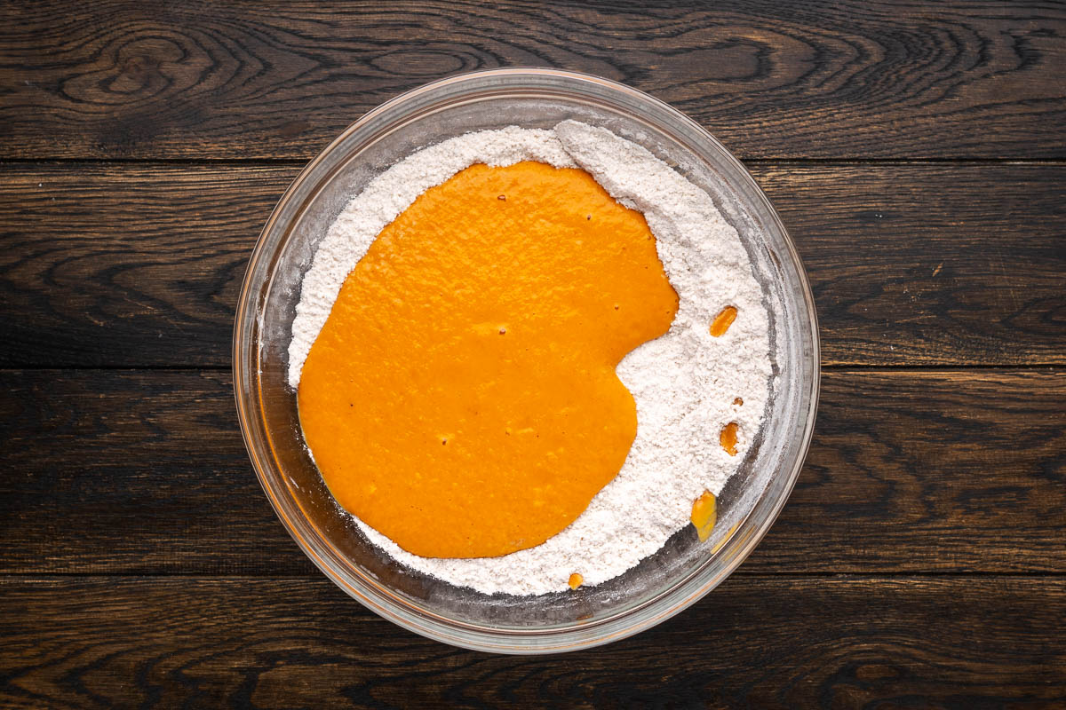 Wet ingredients added to the dry in a bowl.