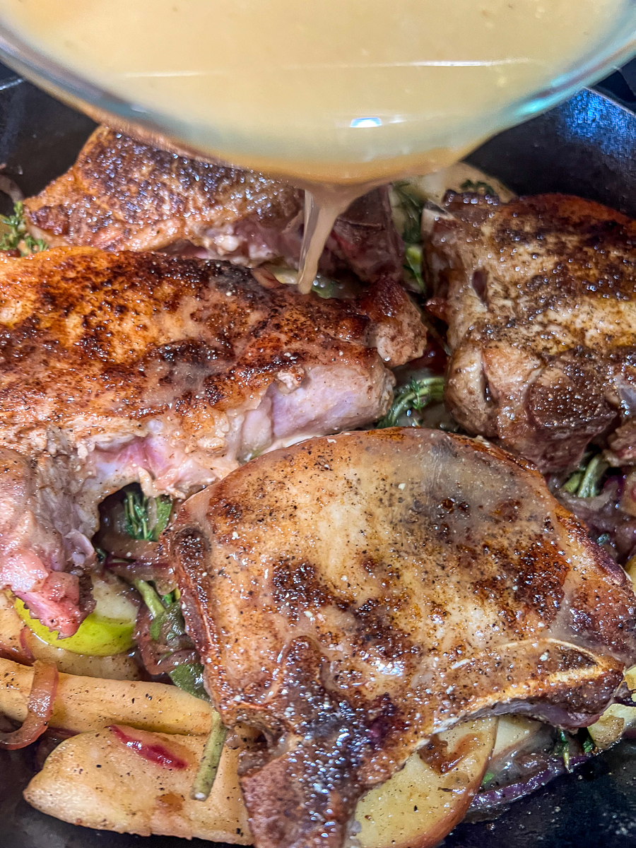 The sauce being poured into the pan.