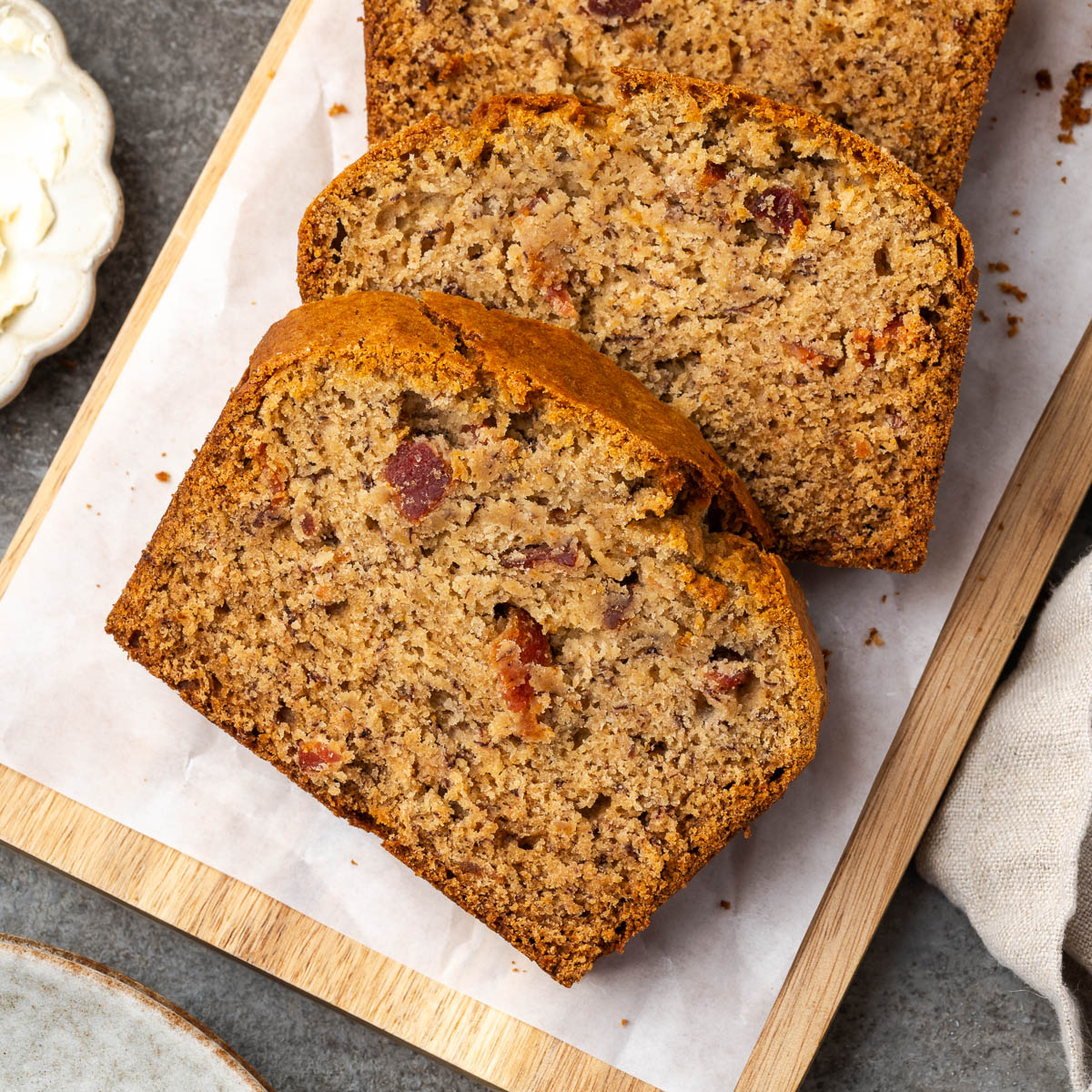 Slices of bacon banana bread on a platter.