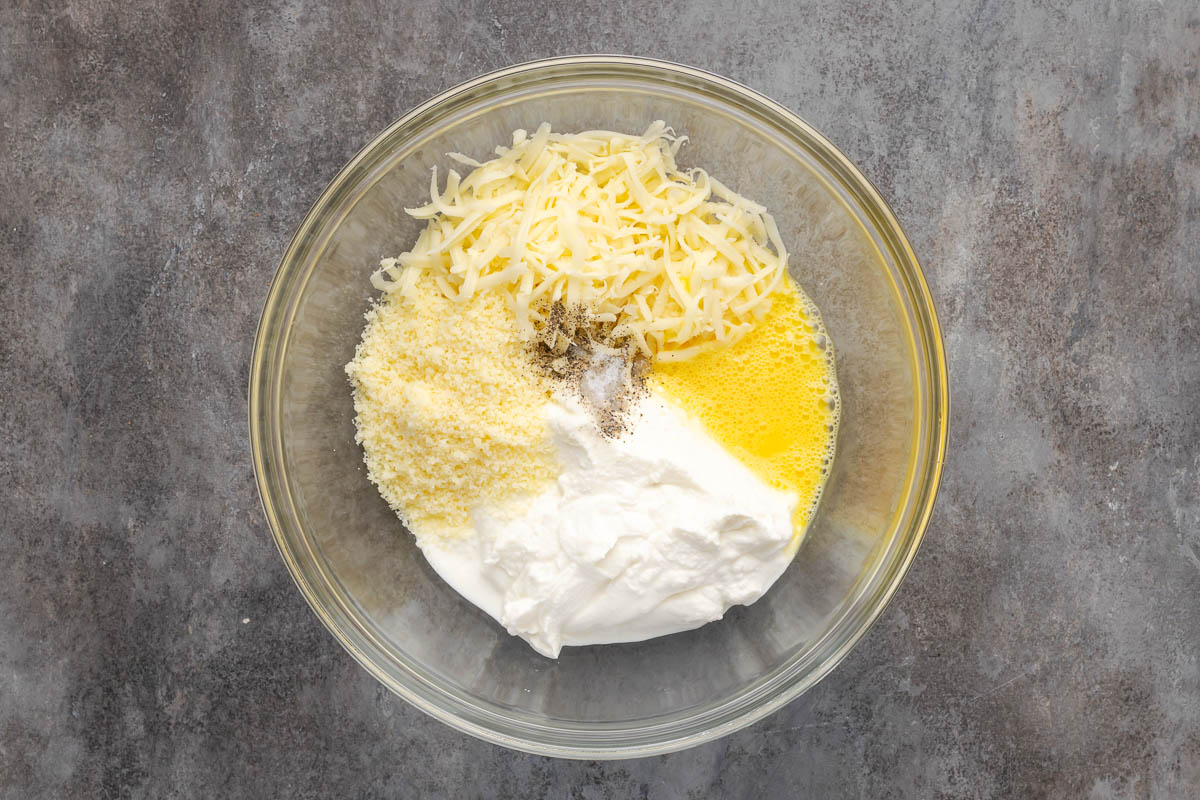 Ingredients to make ricotta cheese mixture in a bowl.