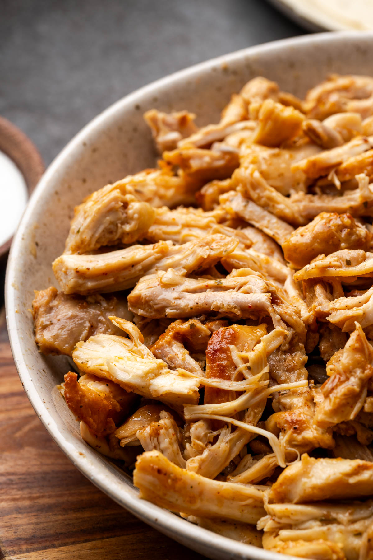 Southwestern chicken thighs shredded up with seasonings on them.
