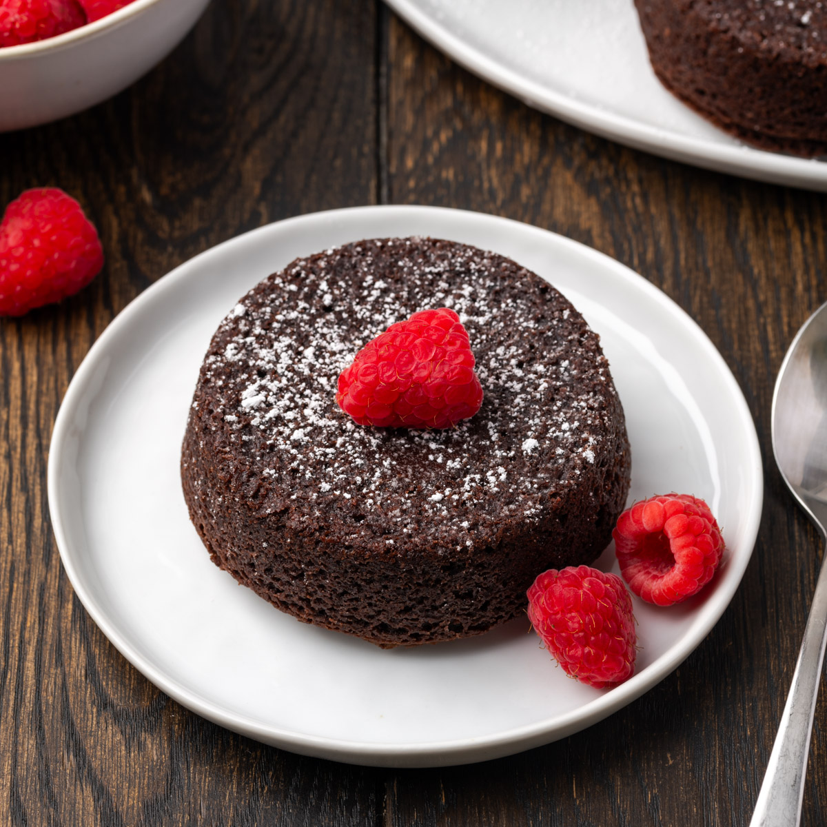 Mini lava cakes on a plate.