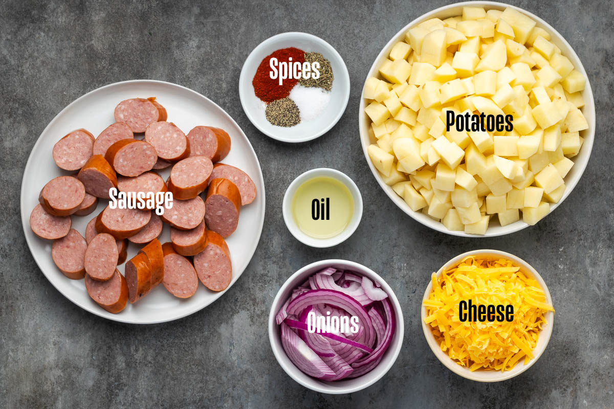 Ingredients to make skillet sausage and potatoes in bowls.