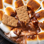 S'mores dip with graham crackers dipped in the chocolate and marshmallow mixture.