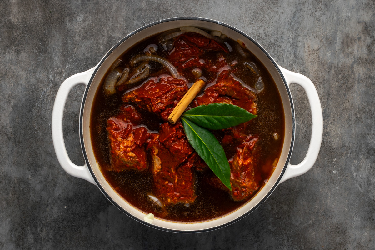 Meat added to the pot. 