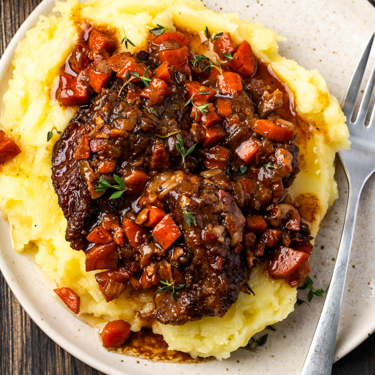 Braised short ribs over potatoes.