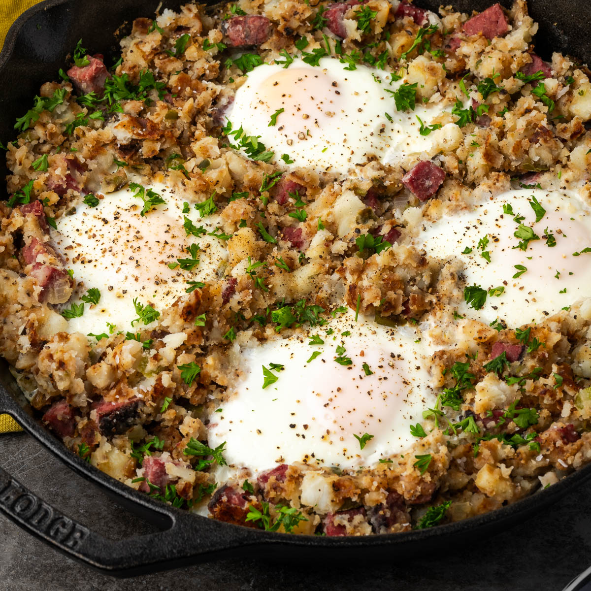 Pastrami hash in a skillet.