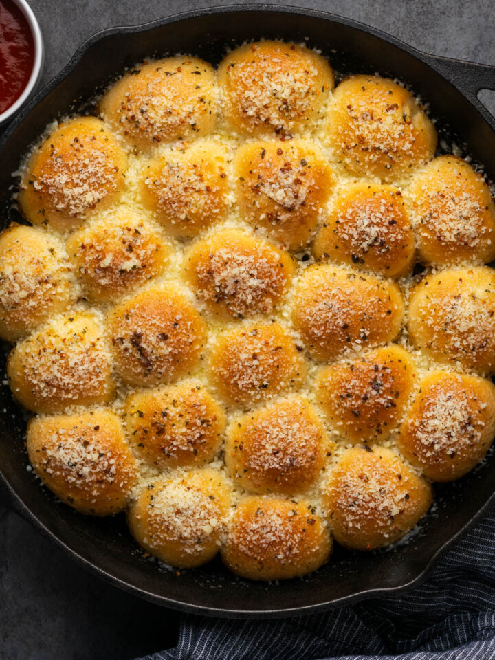 Garlic parmesan pull apart bread in a skillet.