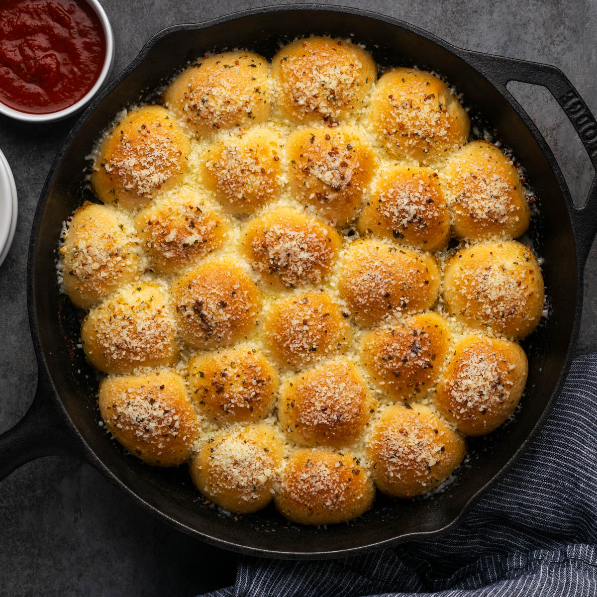 Garlic parmesan pull apart bread in a skillet.