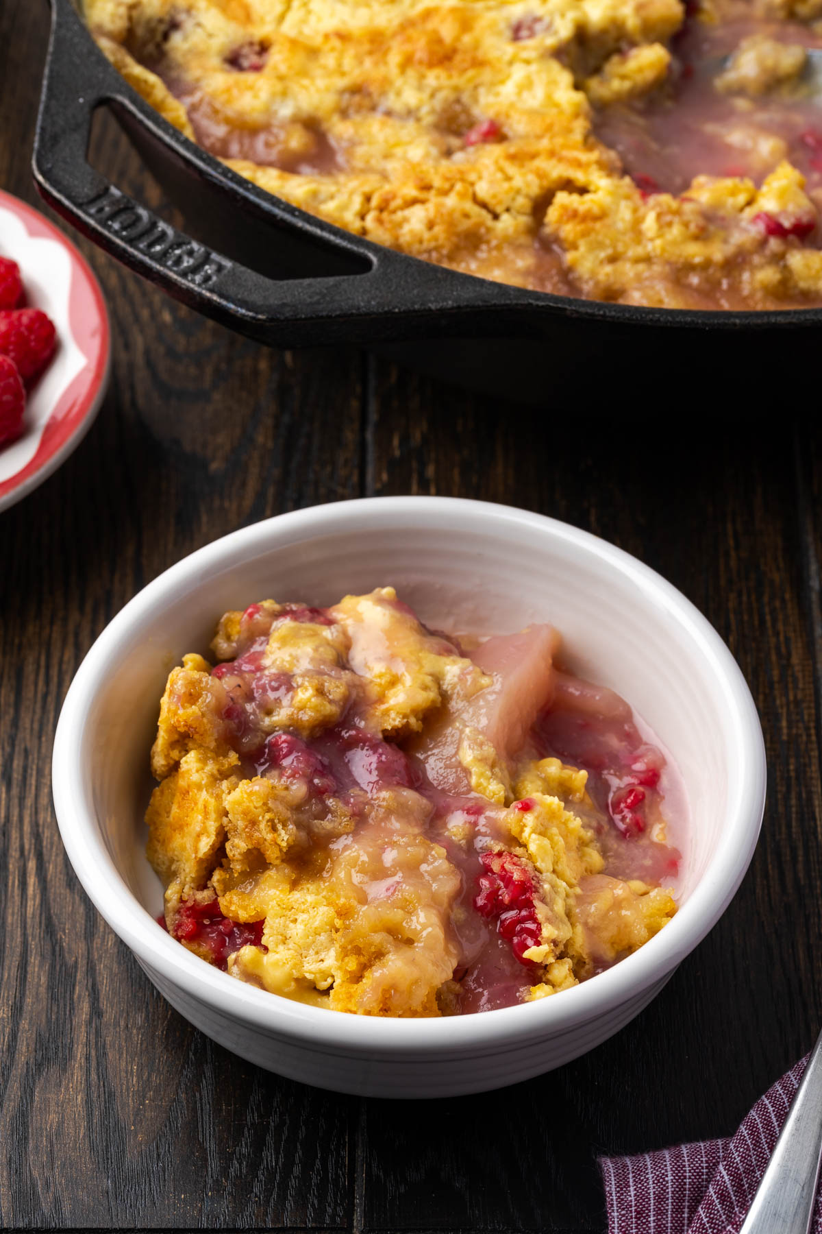 A bowl with some raspberry dump cake.