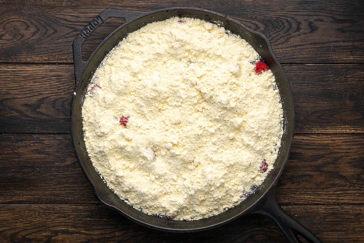 Yellow cake mix spread evenly over the pears and raspberries.