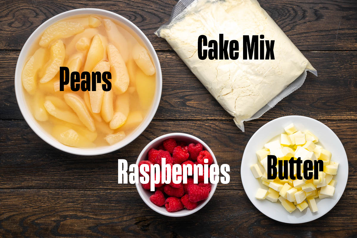 Ingredients to make this pear raspberry cake on a table.