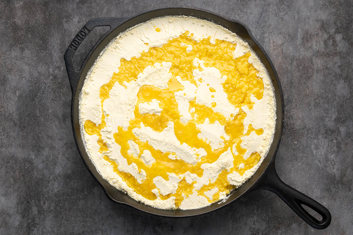 Melted butter drizzled over the cake mix.