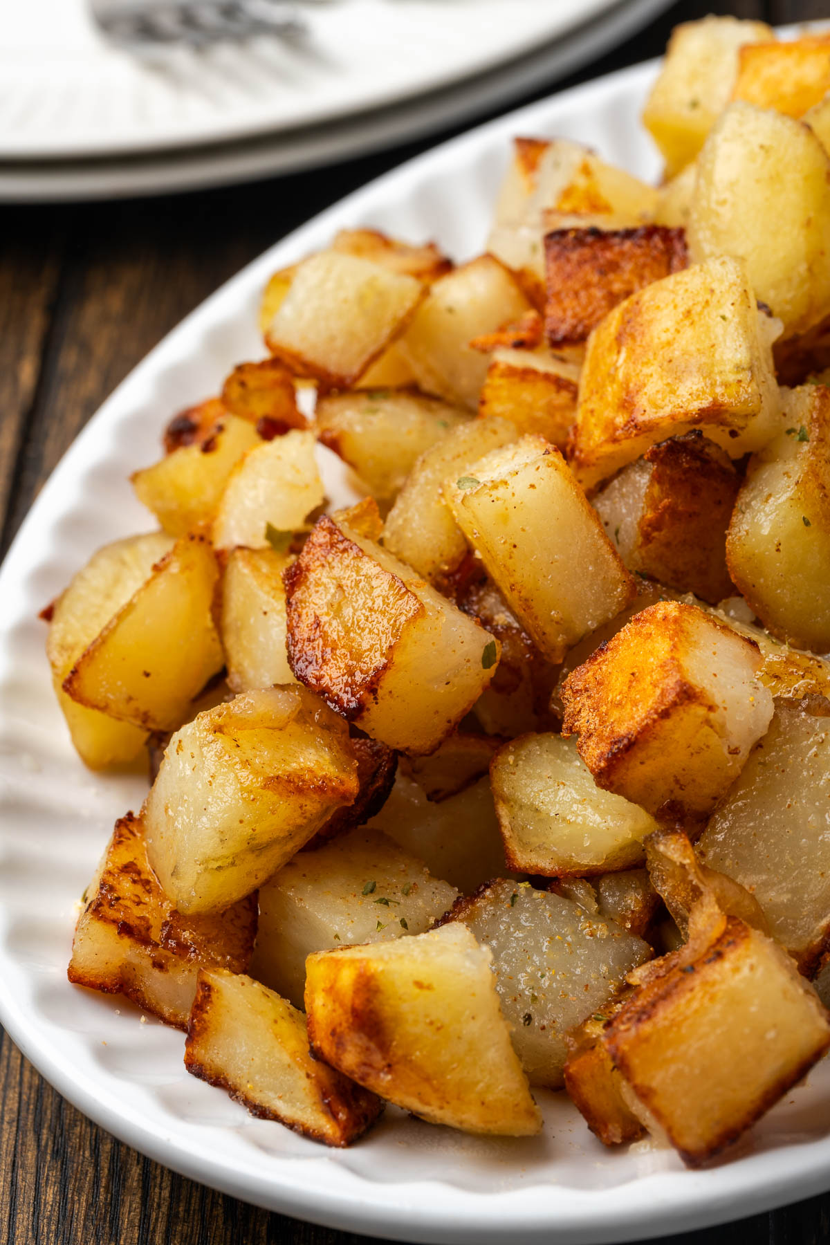 Crispy fried potatoes on a plate.