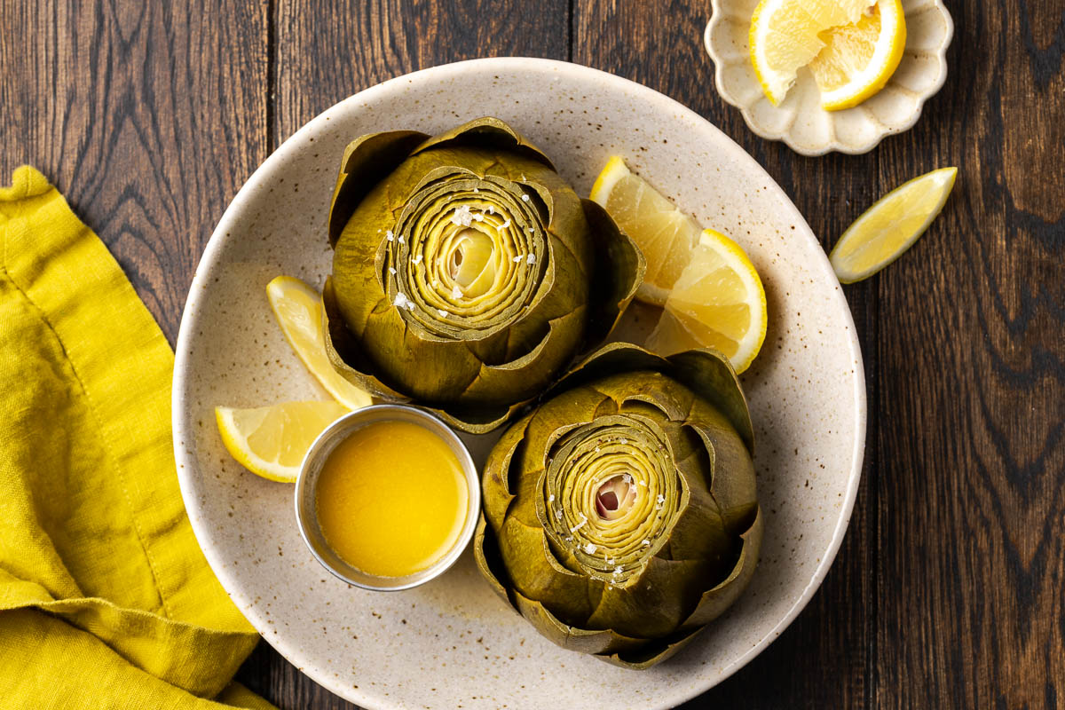 Artichokes removed from the dutch oven and serve with melted butter.