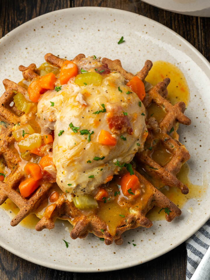 Braised chicken thighs on a plate.