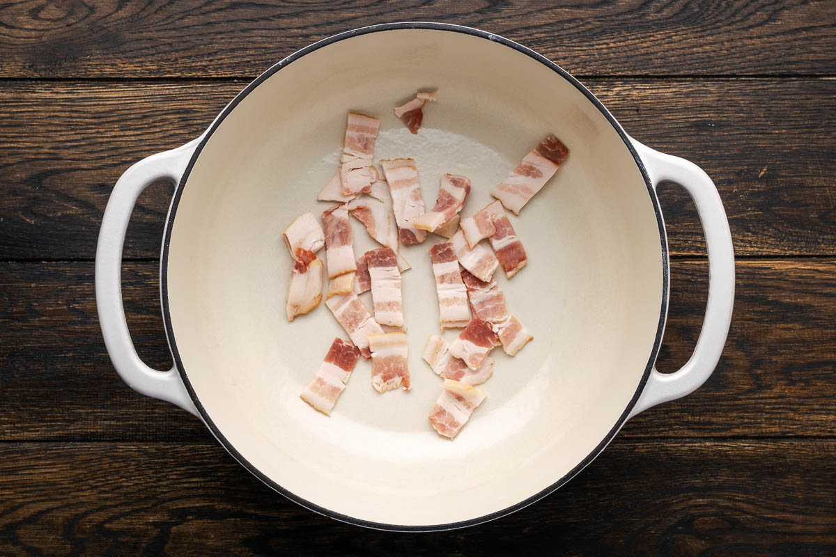 Cut bacon in pan.