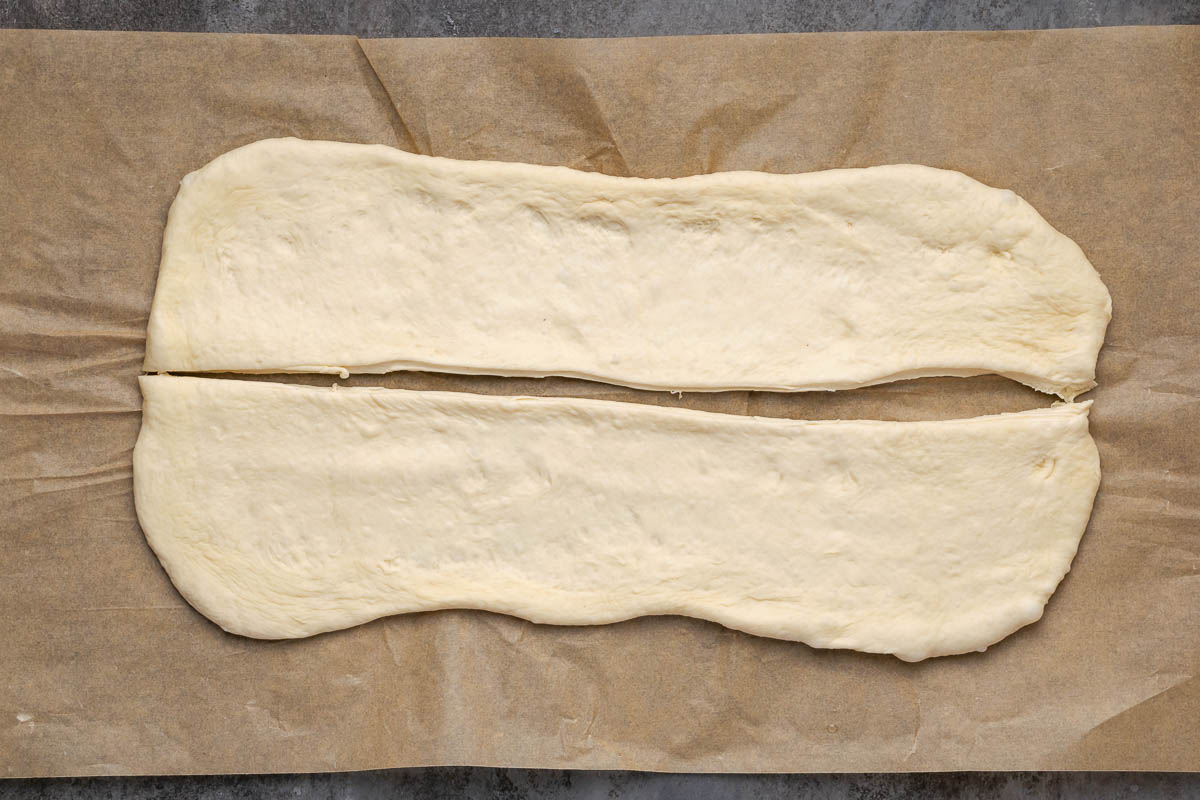 Rolled out dough on parchment paper.