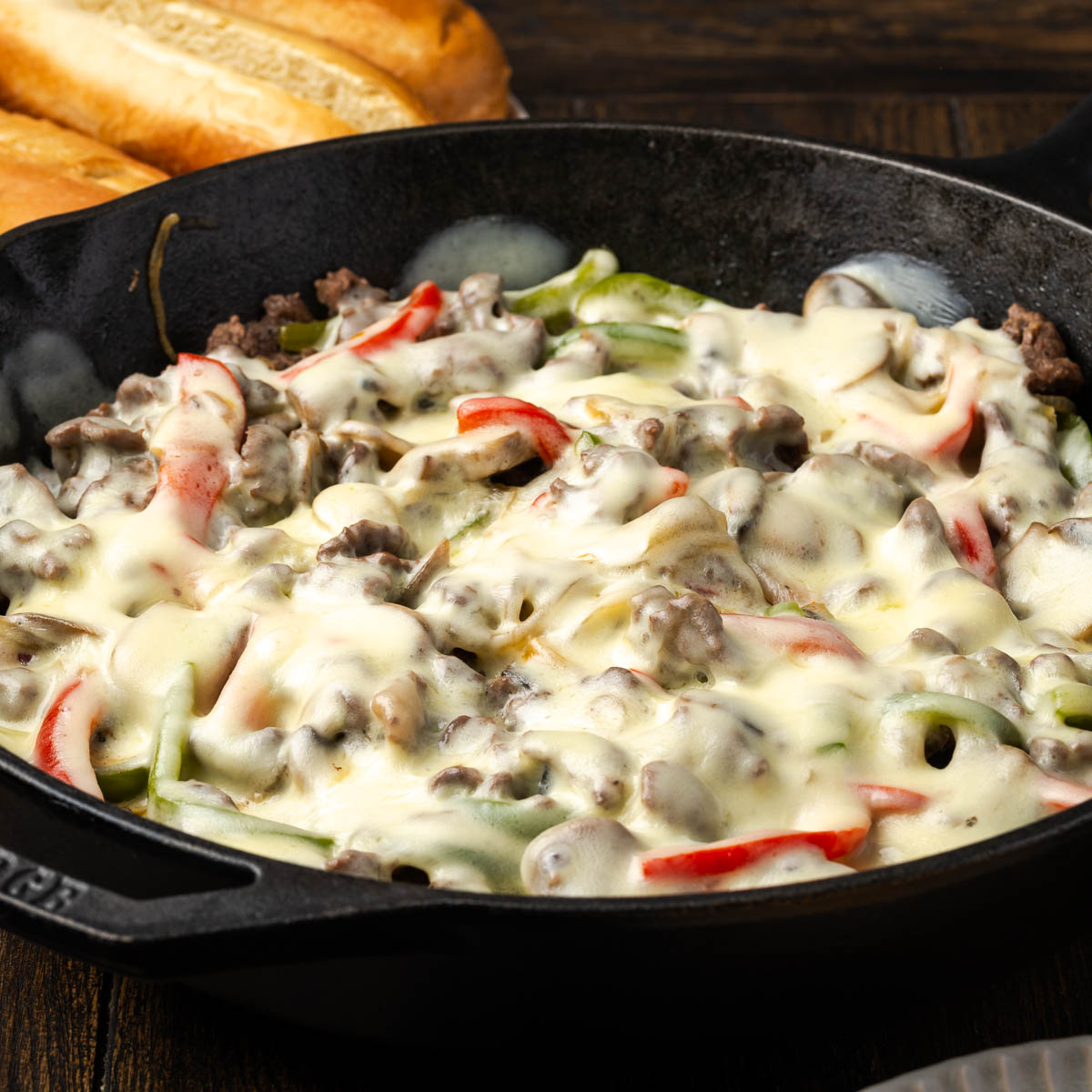 Philly Cheesesteak mixture in a cast iron skillet.