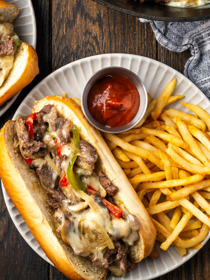Philly cheese steaks on a plate.
