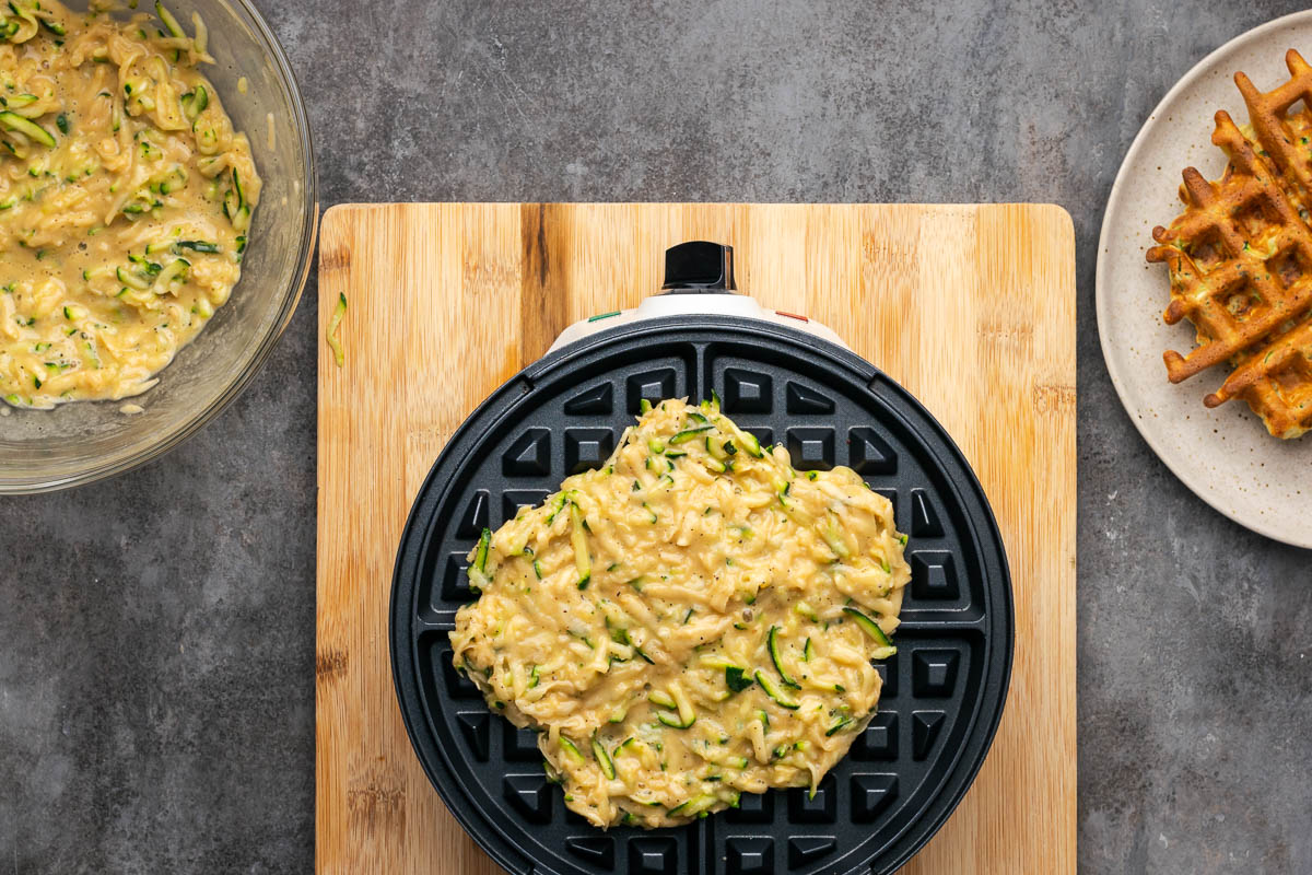 The batter spread into the waffle iron.