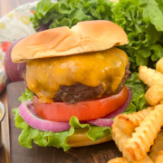 Cast iron skillet burgers with French fries.