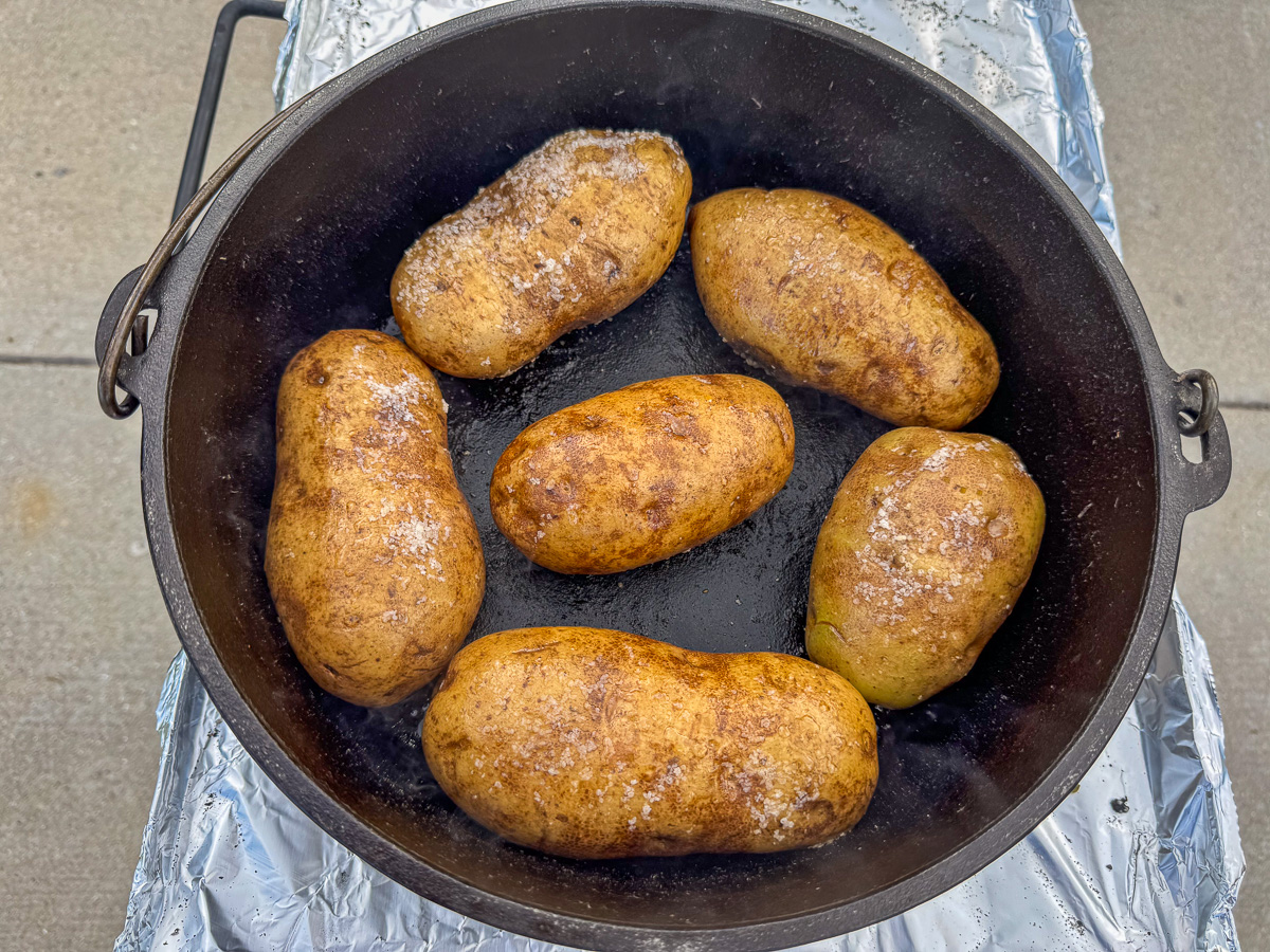 Potatoes added to a Dutch oven ready to cook.