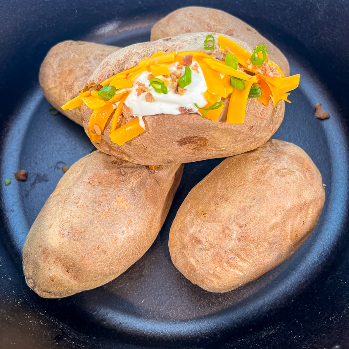 Dutch Oven Baked Potatoes (Campfire & Oven) - Dutch Oven Daddy